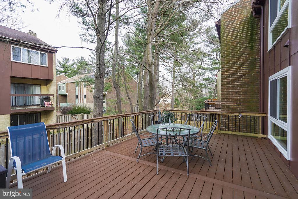 11041 Saffold Way Reston, VA 20190 - Photo 39 of 44 a view of a chair and table on the wooden floor