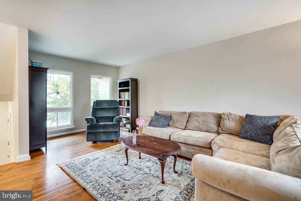 11041 Saffold Way Reston, VA 20190 - Photo 5 of 44 a living room with furniture and wooden floor