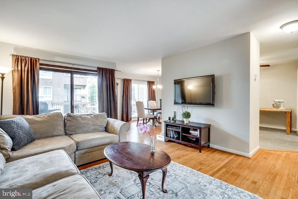 11041 Saffold Way Reston, VA 20190 - Photo 7 of 44 a living room with furniture and a flat screen tv