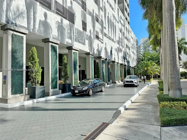 a view of a building with sitting area