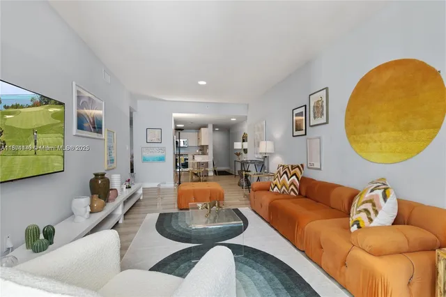 a living room with furniture and a large window