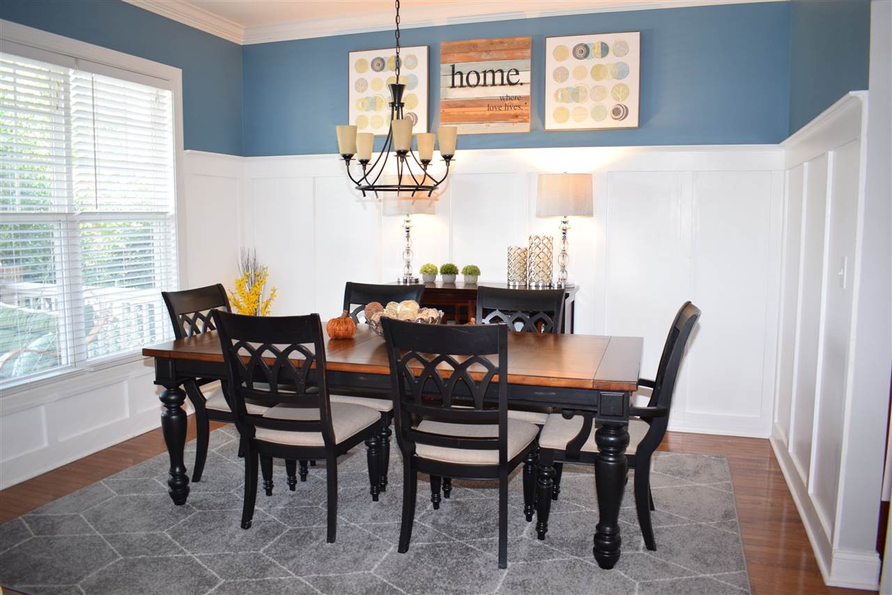 10108 2nd Star Court Raleigh, NC 27613 - Photo 3 of 23 Dining room with hardwood floors, 3/4 wainscoting & crown molding. Dining Room