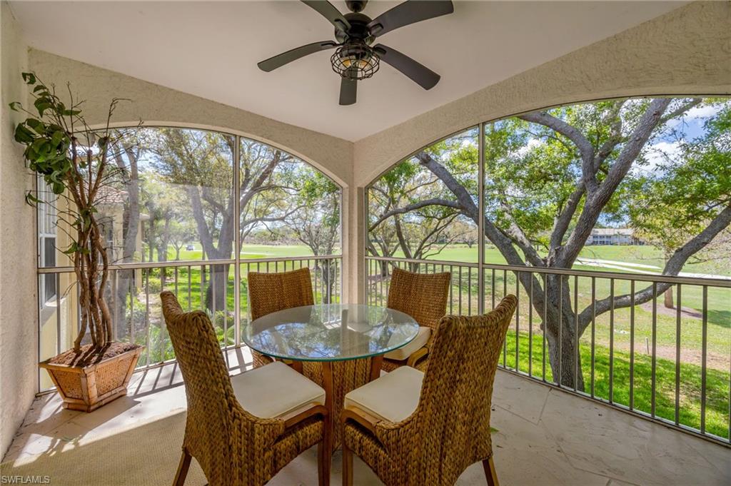 89 Silver Oaks Circle, Unit 5201 Naples, FL 34119 - Photo 1 of 21 a view of a dining room with furniture window and outside view