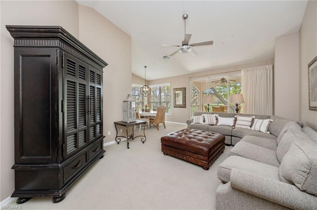 89 Silver Oaks Circle, Unit 5201 Naples, FL 34119 - Photo 3 of 21 a living room with furniture and a window