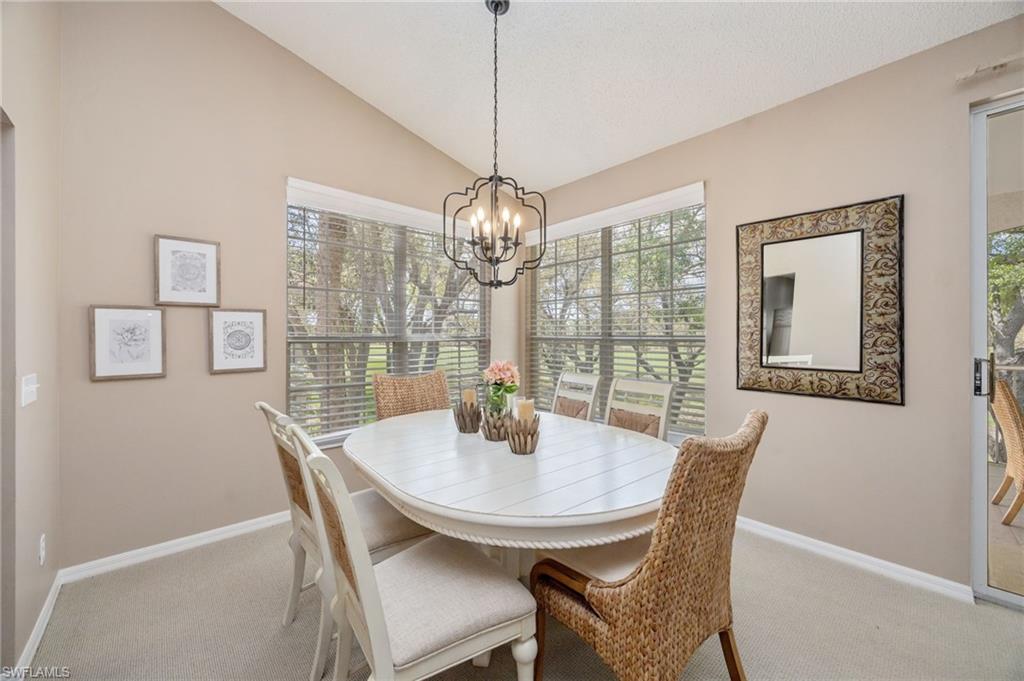 89 Silver Oaks Circle, Unit 5201 Naples, FL 34119 - Photo 4 of 21 a dining room with furniture and window