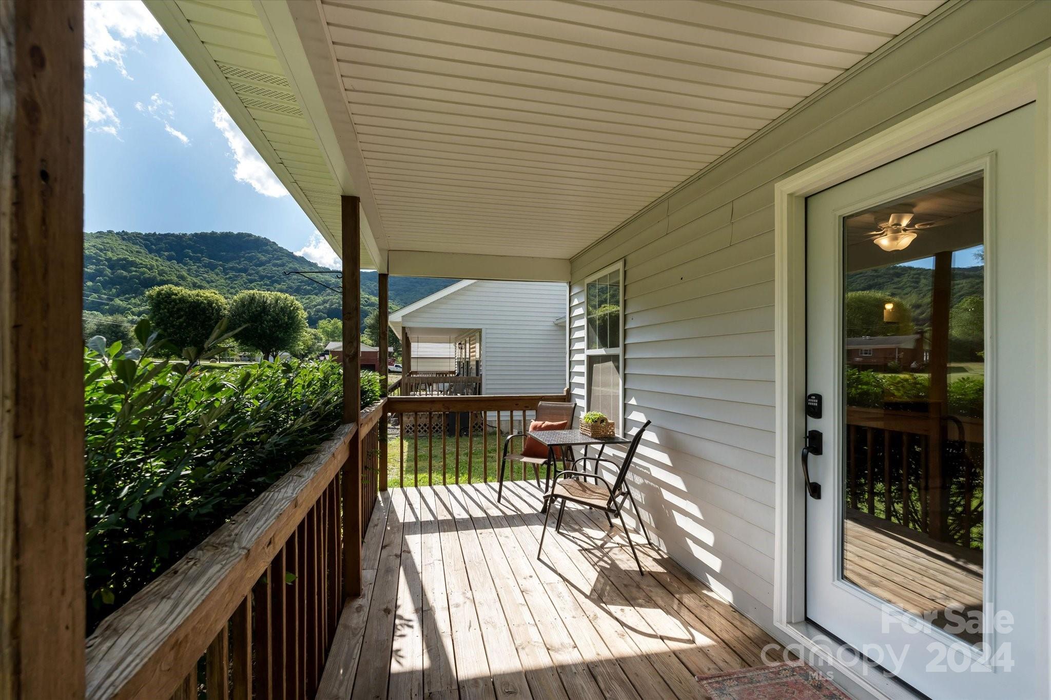 634 Dillingham Road, Unit B Barnardsville, NC 28709 - Photo 11 of 32 a balcony view with a potted plant