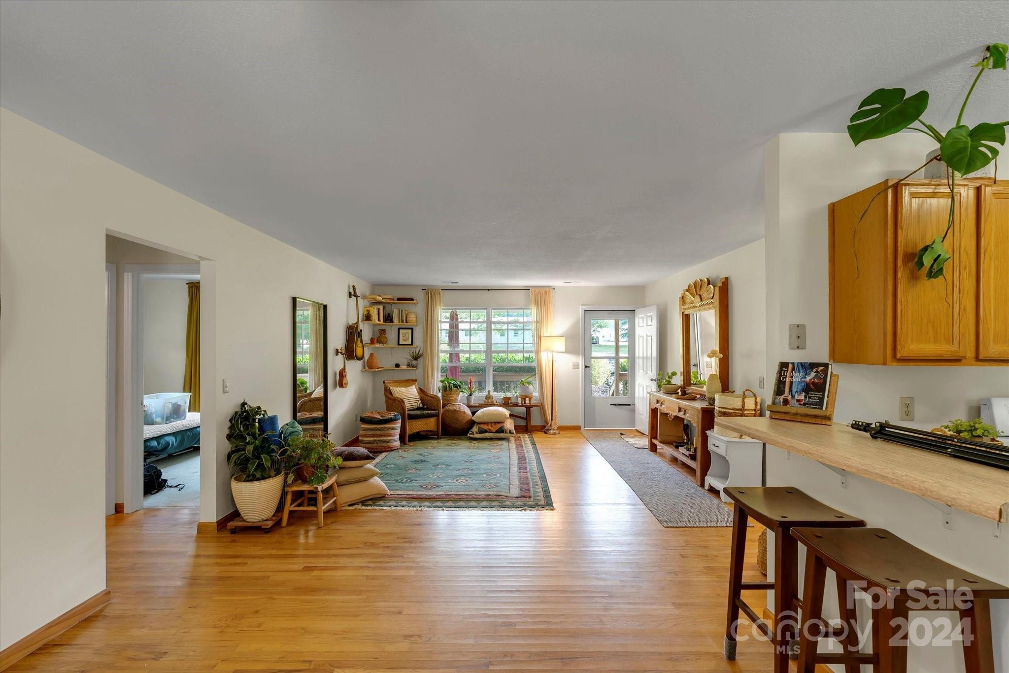 634 Dillingham Road, Unit B Barnardsville, NC 28709 - Photo 12 of 32 a living room with furniture and a large window
