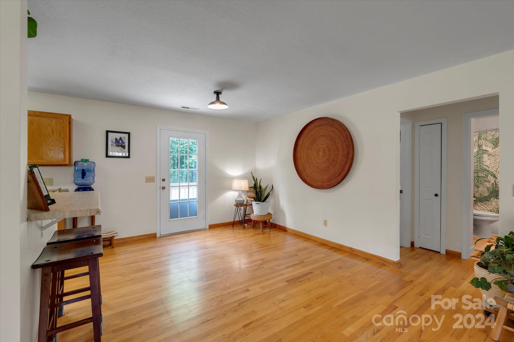 634 Dillingham Road, Unit B Barnardsville, NC 28709 - Photo 14 of 32 a view of a room with wooden floor and entryway