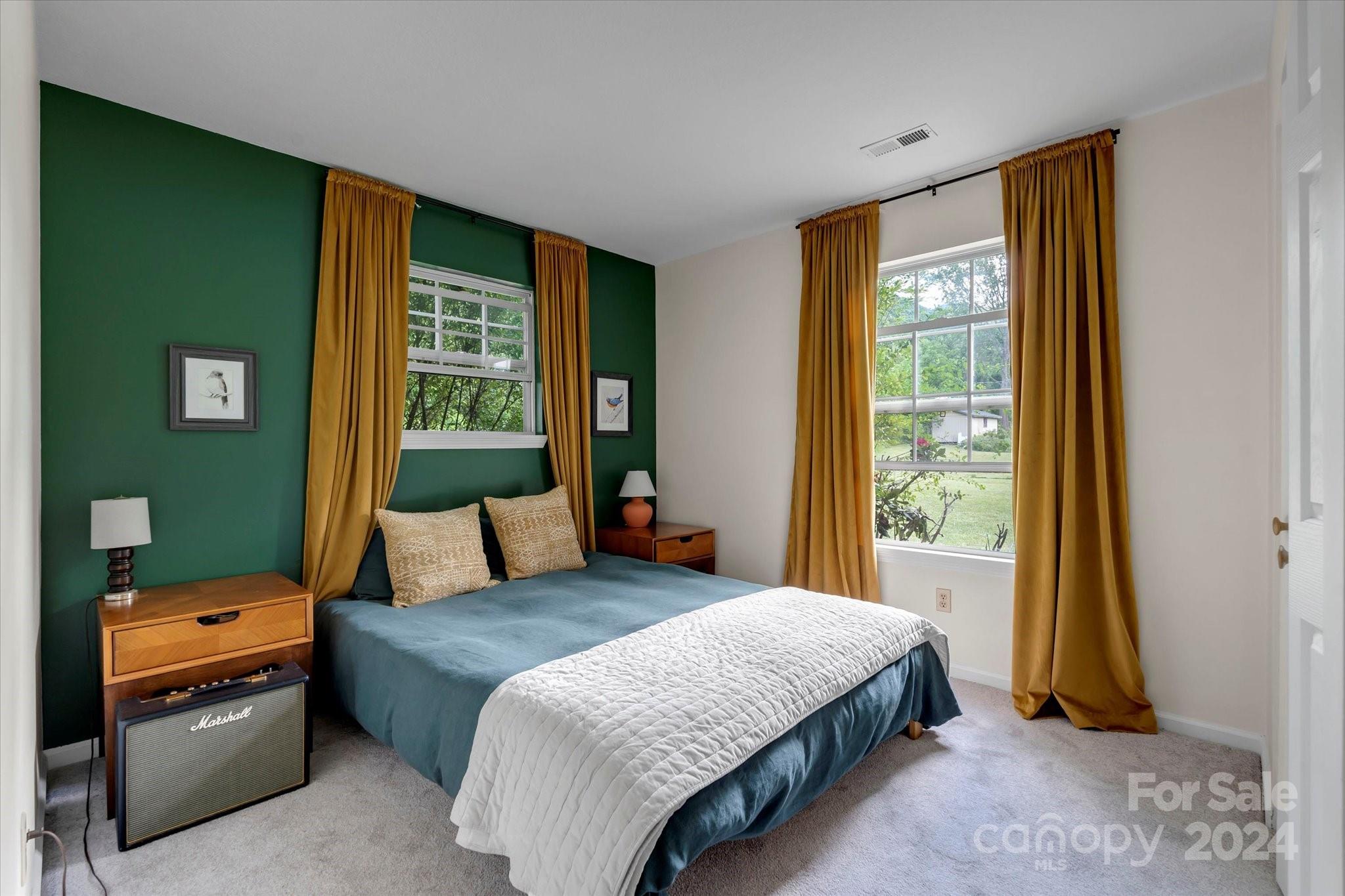 634 Dillingham Road, Unit B Barnardsville, NC 28709 - Photo 19 of 32 a bedroom with a bed and a window