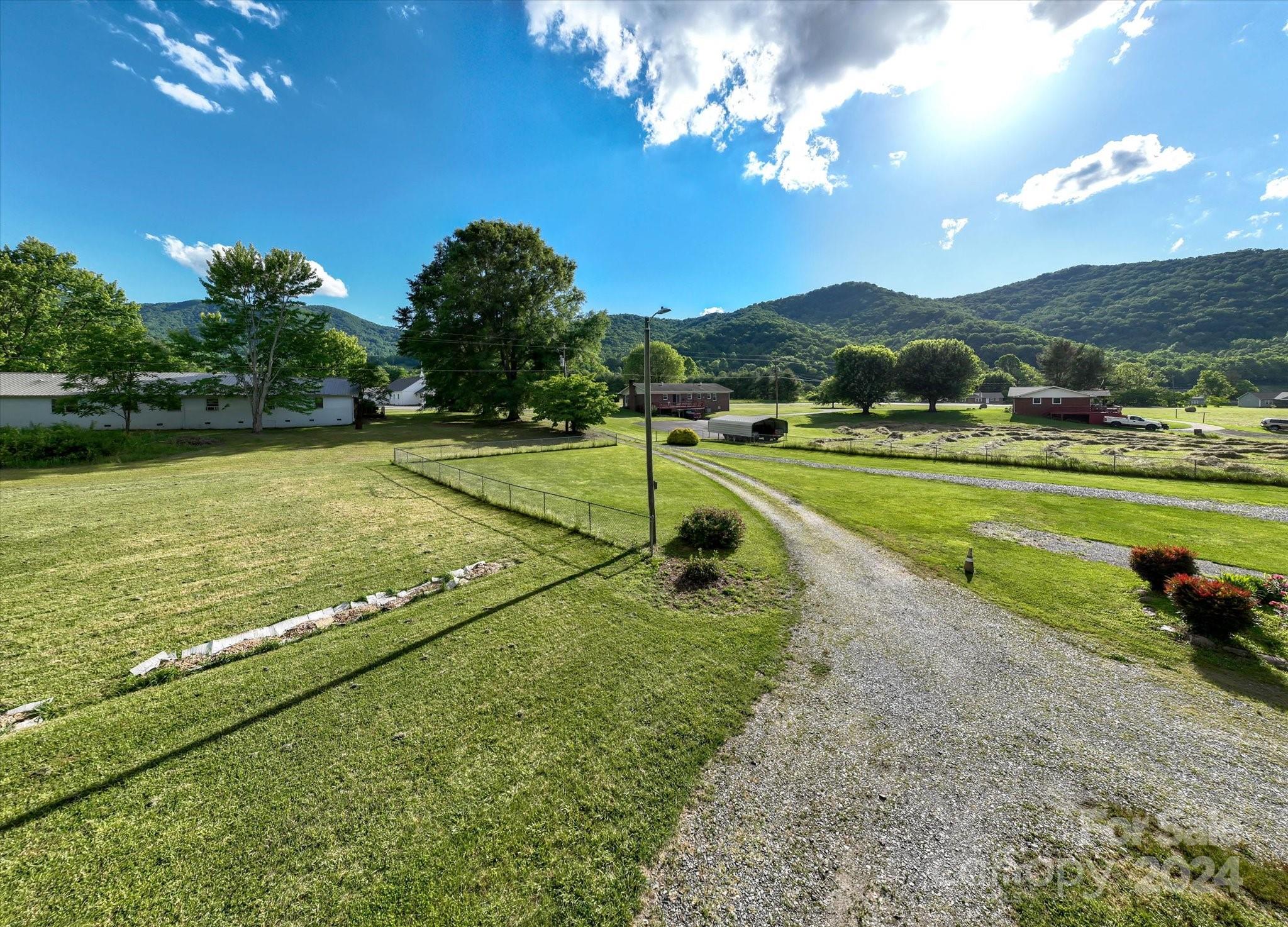 634 Dillingham Road, Unit B Barnardsville, NC 28709 - Photo 2 of 32 a view of a golf course with a lake view