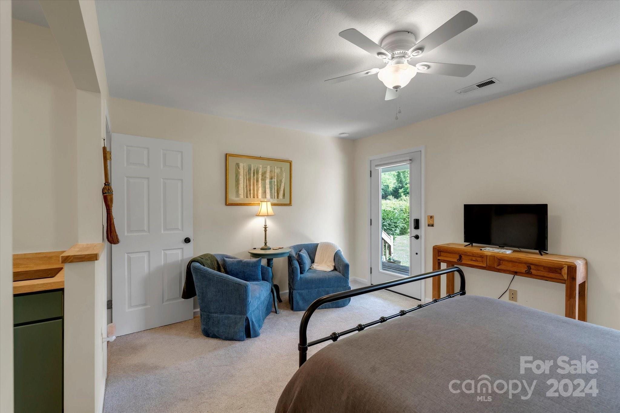 634 Dillingham Road, Unit B Barnardsville, NC 28709 - Photo 22 of 32 a bedroom with furniture and a window