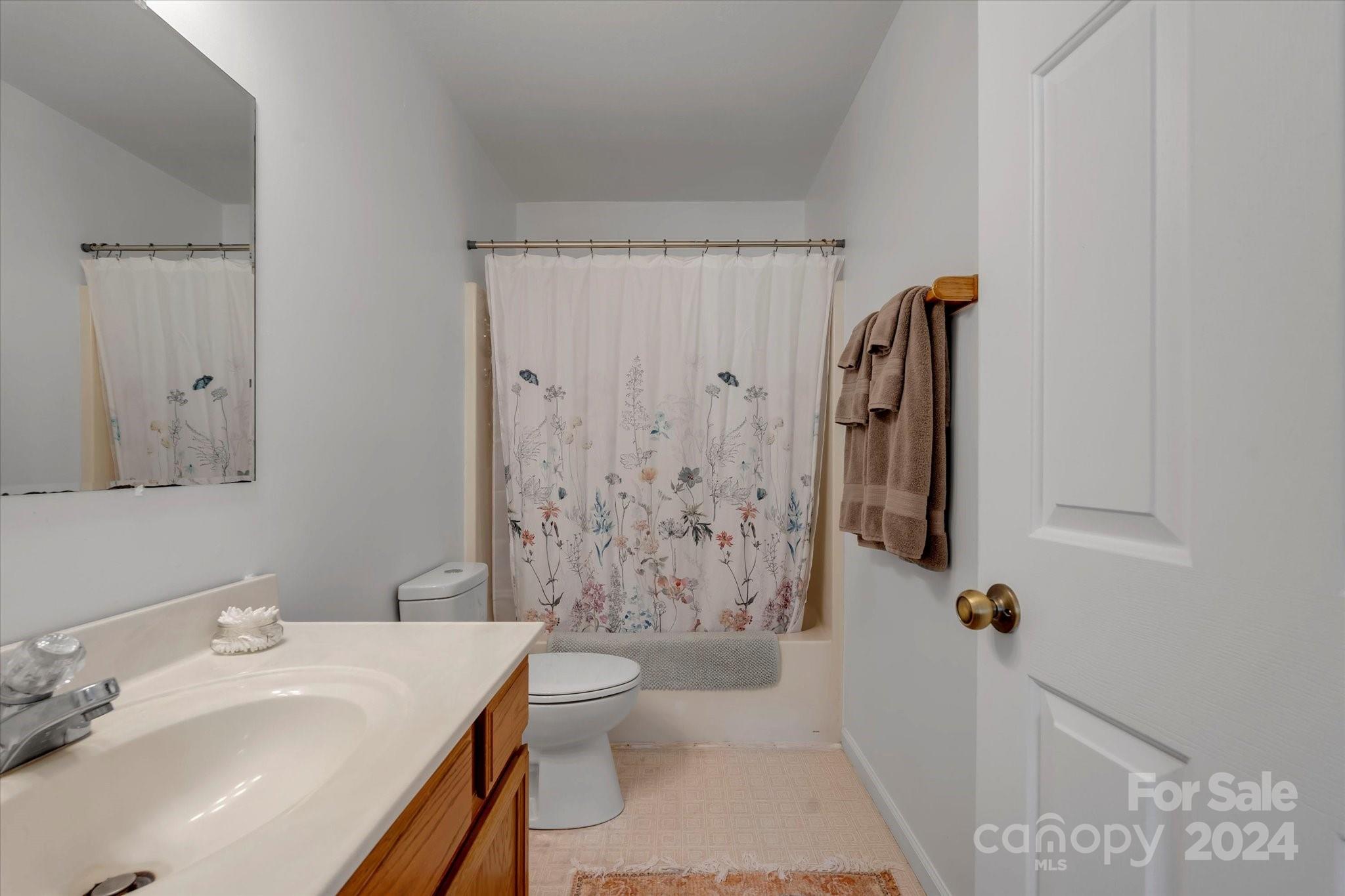 634 Dillingham Road, Unit B Barnardsville, NC 28709 - Photo 24 of 32 a bathroom with a sink toilet and shower
