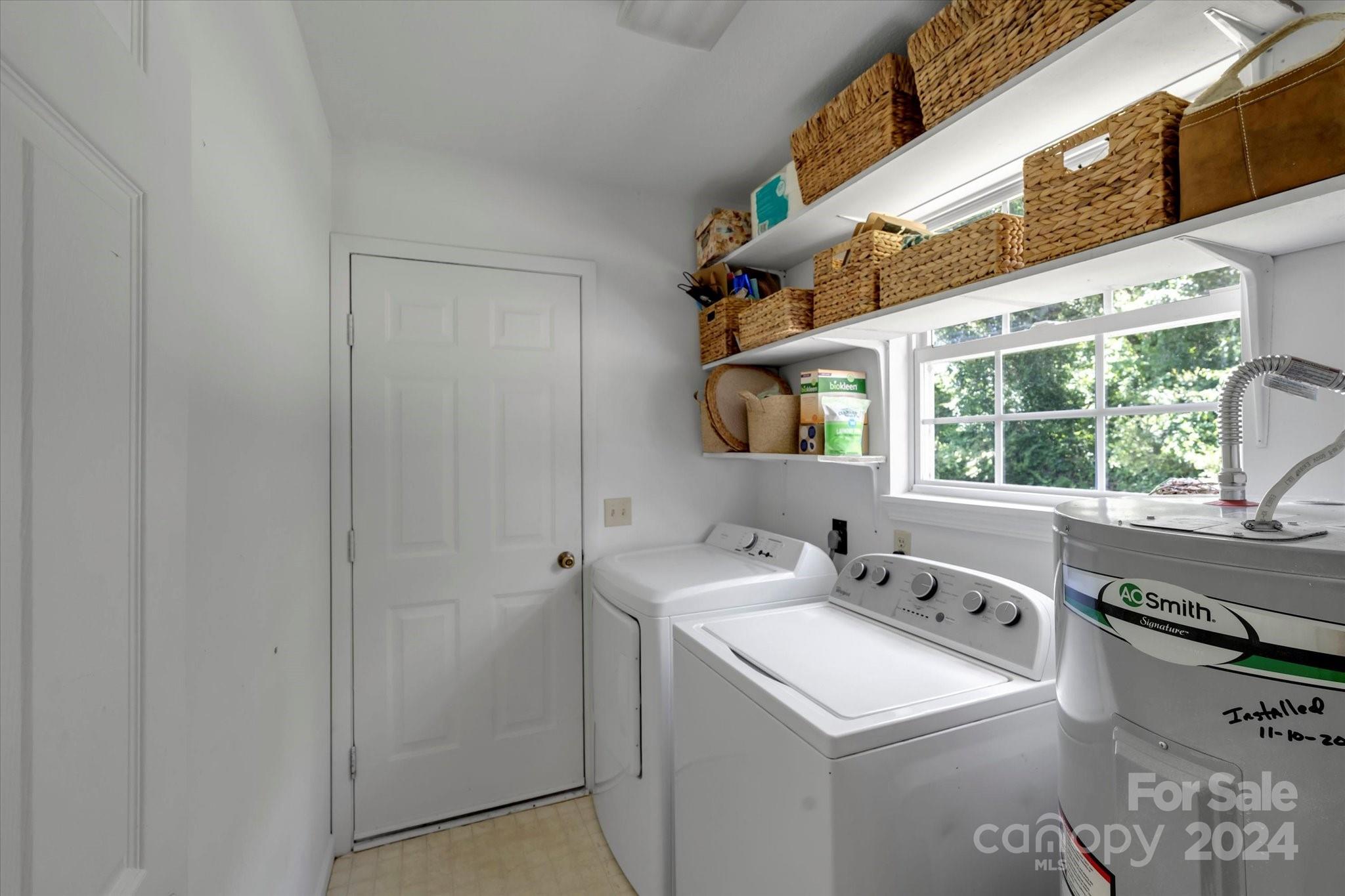 634 Dillingham Road, Unit B Barnardsville, NC 28709 - Photo 25 of 32 a utility room with dryer and washer