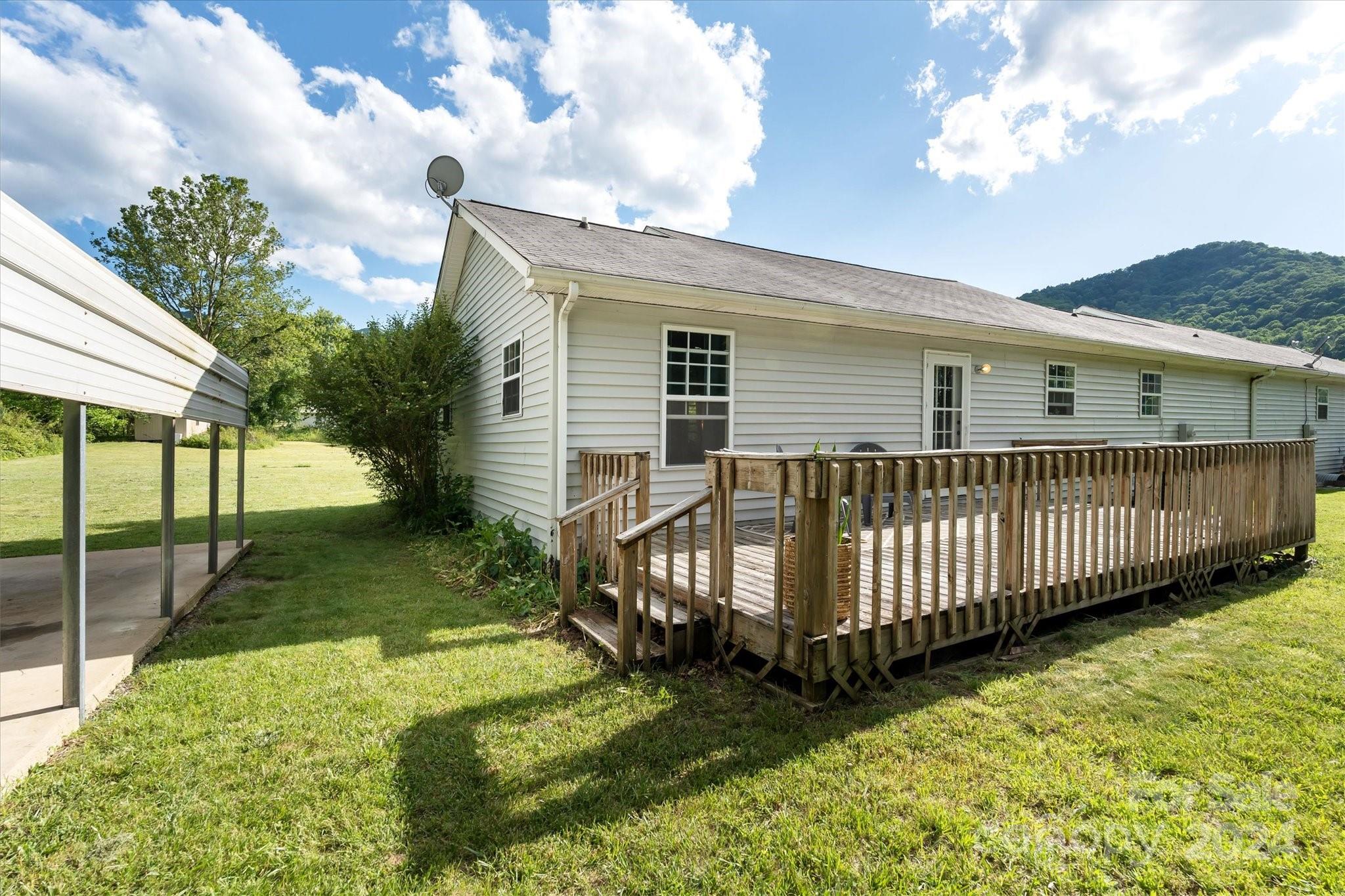 634 Dillingham Road, Unit B Barnardsville, NC 28709 - Photo 26 of 32 a view of a house with a yard