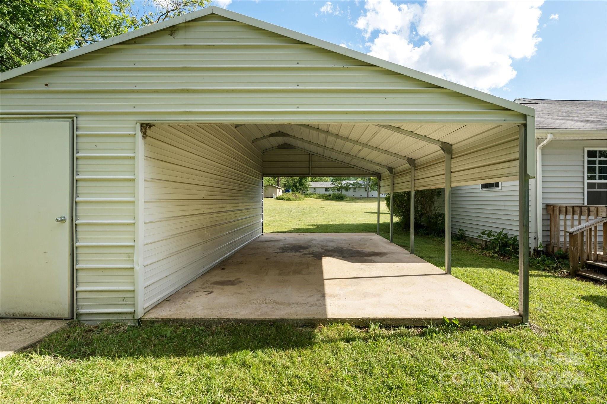 634 Dillingham Road, Unit B Barnardsville, NC 28709 - Photo 29 of 32 a side view of a house with a yard