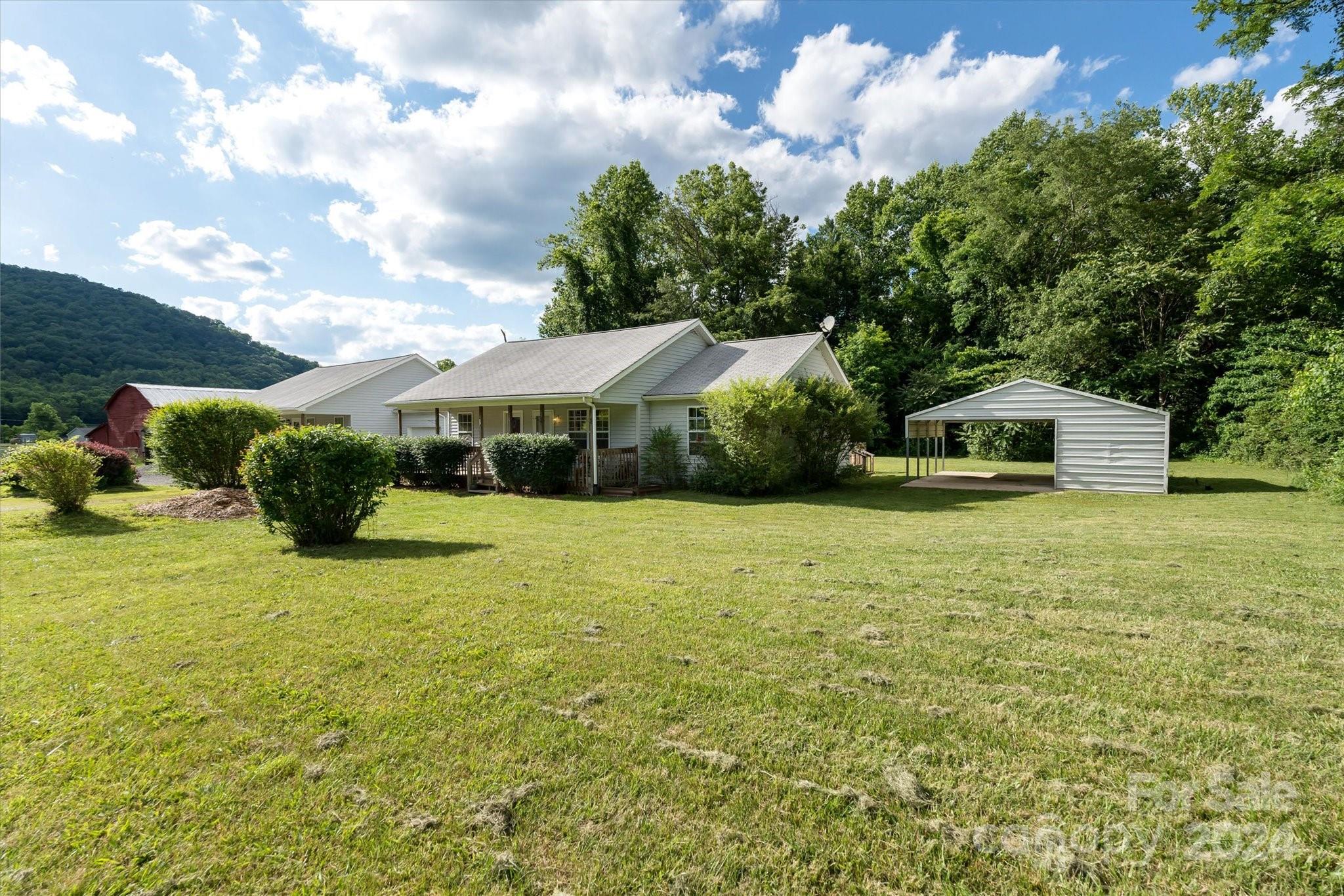 634 Dillingham Road, Unit B Barnardsville, NC 28709 - Photo 3 of 32 a house view with a garden space