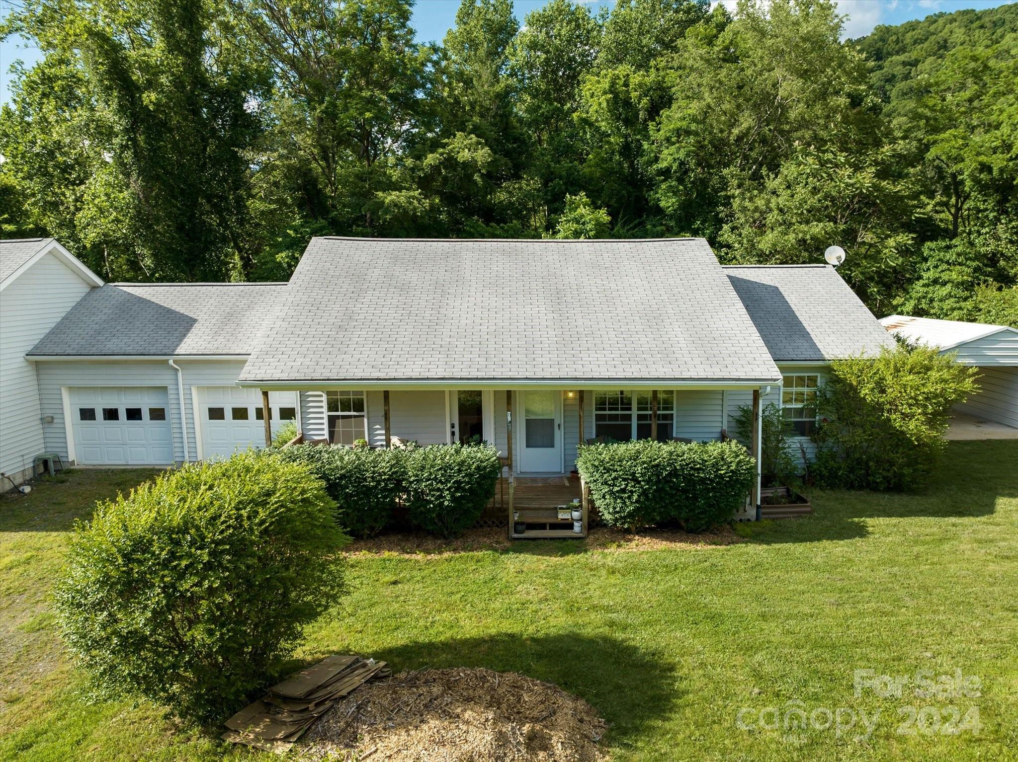 634 Dillingham Road, Unit B Barnardsville, NC 28709 - Photo 4 of 32 front view of a house with a yard