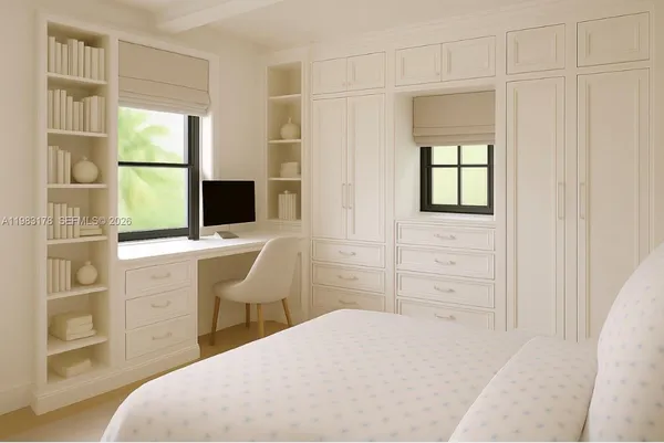 a bedroom with a bed and a desk