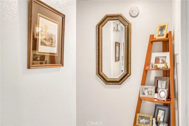 a bedroom with two beds and a lamp