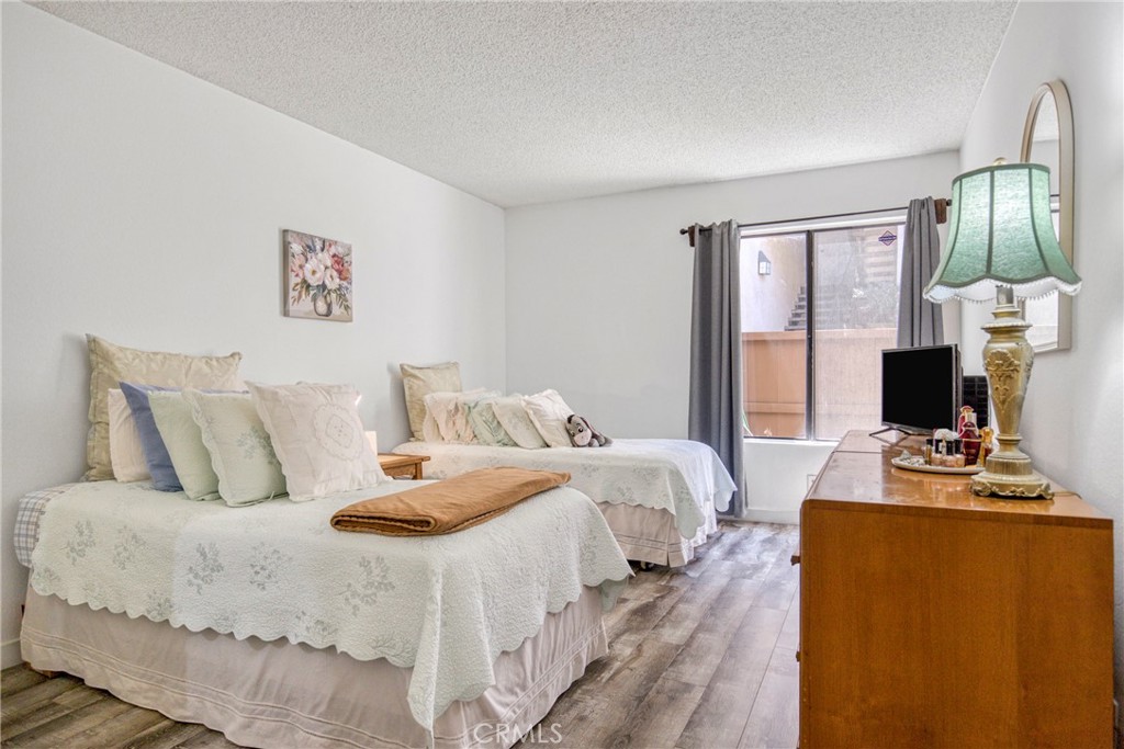 15155 Sherman Way, Unit 14 Van Nuys, CA 91405 - Photo 18 of 36 a bedroom with bed and window