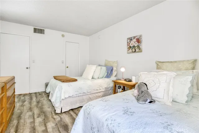 a bathroom with a granite countertop toilet sink and a mirror