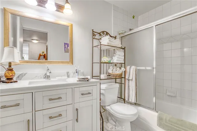 a view of a dining room with furniture and a potted plant
