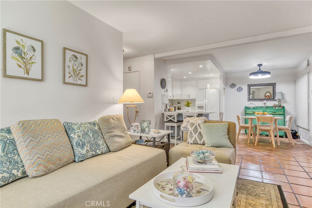 15155 Sherman Way, Unit 14 Van Nuys, CA 91405 - Photo 22 of 36 a living room with furniture and wooden floor