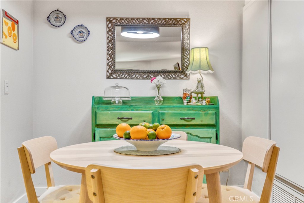 15155 Sherman Way, Unit 14 Van Nuys, CA 91405 - Photo 23 of 36 a view of a dining room with furniture and a potted plant
