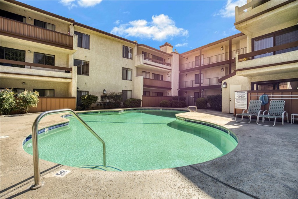 15155 Sherman Way, Unit 14 Van Nuys, CA 91405 - Photo 29 of 36 a view of a house with swimming pool