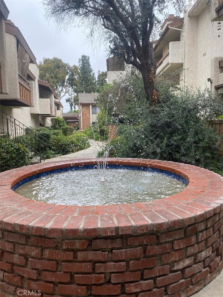 15155 Sherman Way, Unit 14 Van Nuys, CA 91405 - Photo 30 of 36 a view of a backyard with swimming pool