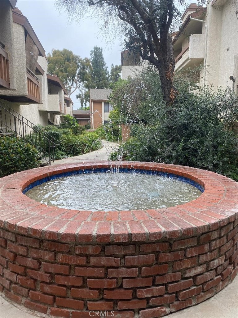 15155 Sherman Way, Unit 14 Van Nuys, CA 91405 - Photo 5 of 36 a view of a backyard with plants