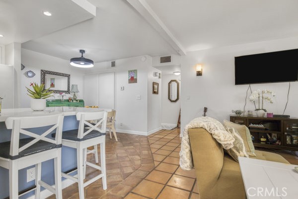 15155 Sherman Way, Unit 14 Van Nuys, CA 91405 - Photo 6 of 36 a living room with furniture and a flat screen tv