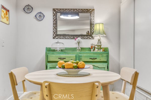 15155 Sherman Way, Unit 14 Van Nuys, CA 91405 - Photo 10 of 36 a view of a dining room with furniture and a potted plant