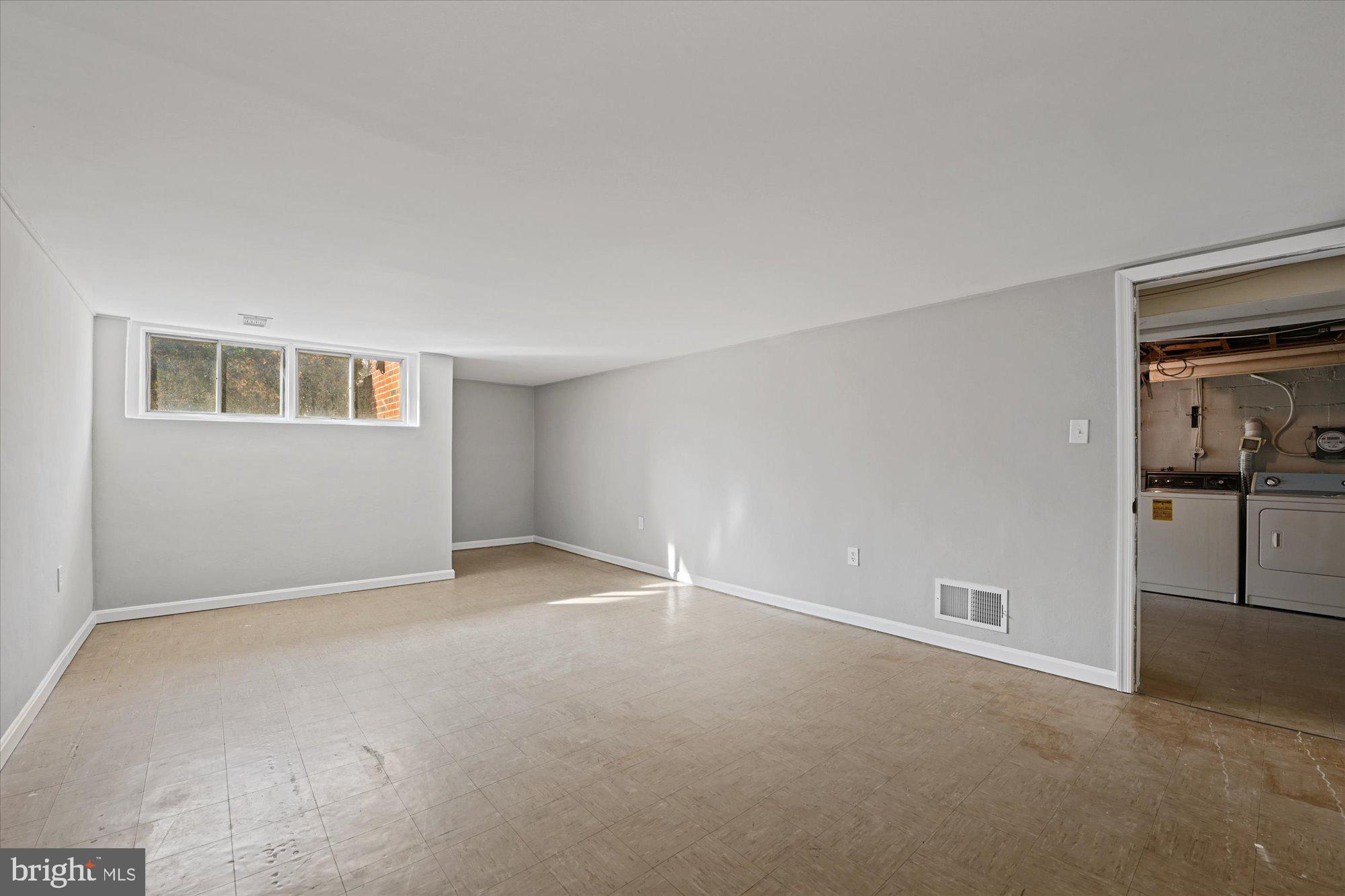 6807 Barnett Road Baltimore, MD 21239 - Photo 20 of 24 Large rec room with larger windows