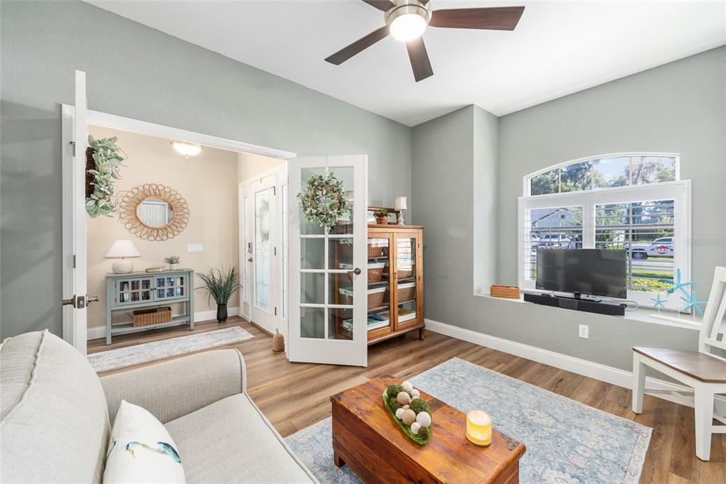 19639 Southwest 77th Loop Dunnellon, FL 34432 - Photo 16 of 59 a living room with furniture and a flat screen tv