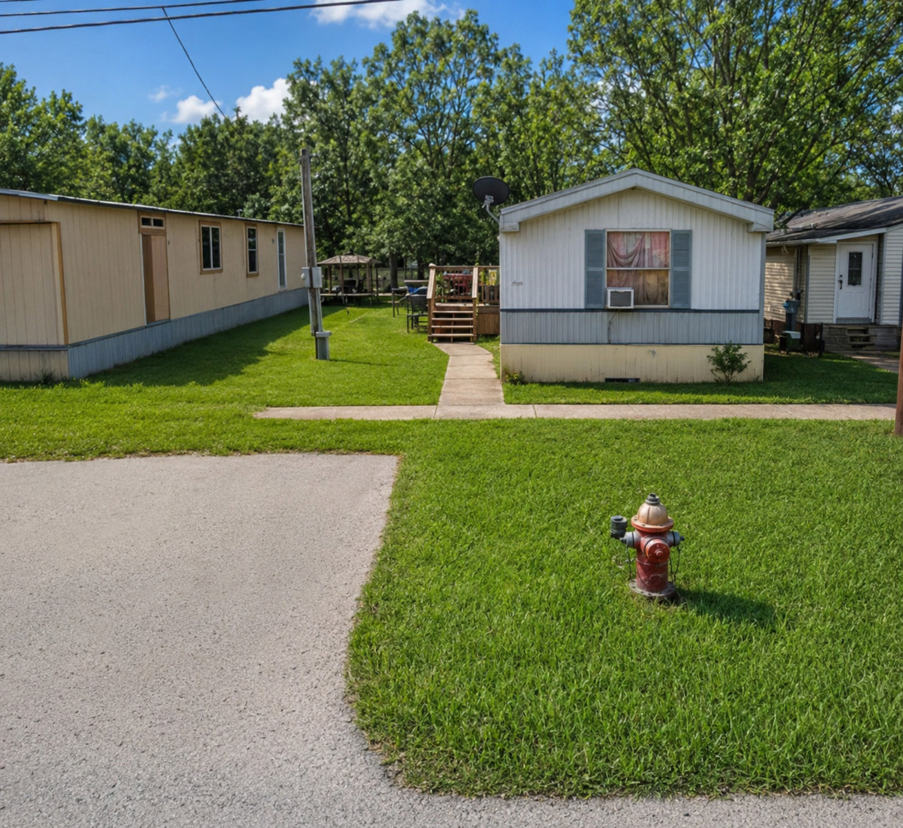 A well-maintained lawn welcomes you to this cozy single-story residence with a charming front deck.