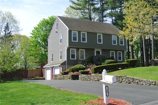 20 Larson Road Milford, MA 01757 - Photo 12 of 13 a front view of a house with garden and porch