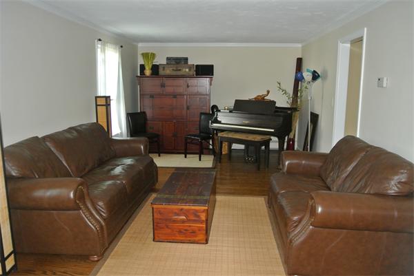 20 Larson Road Milford, MA 01757 - Photo 3 of 13 a living room with furniture and a piano