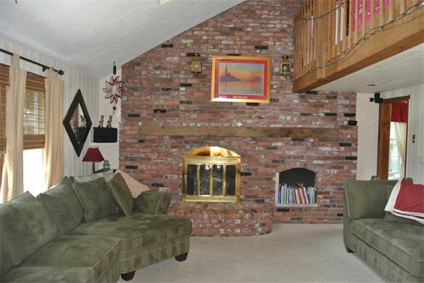 20 Larson Road Milford, MA 01757 - Photo 4 of 13 a living room with furniture and a fireplace