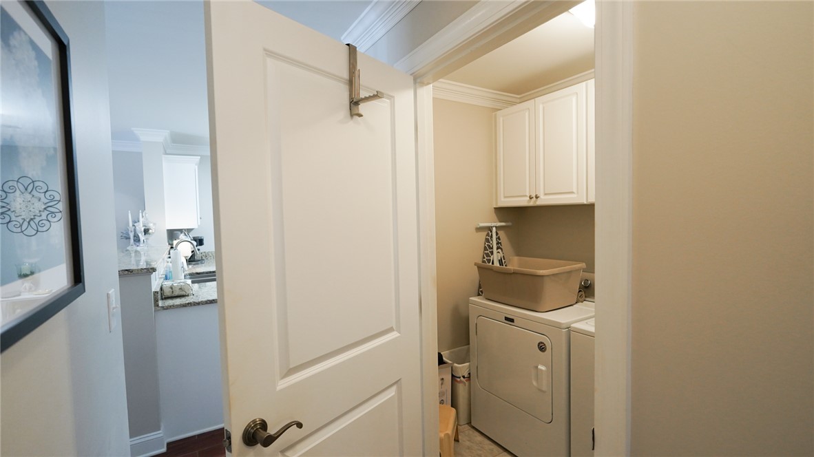 303 Lookover Drive Anderson, SC 29621 - Photo 15 of 46 This dedicated laundry area offers practical convenience with essential appliances and cabinetry.