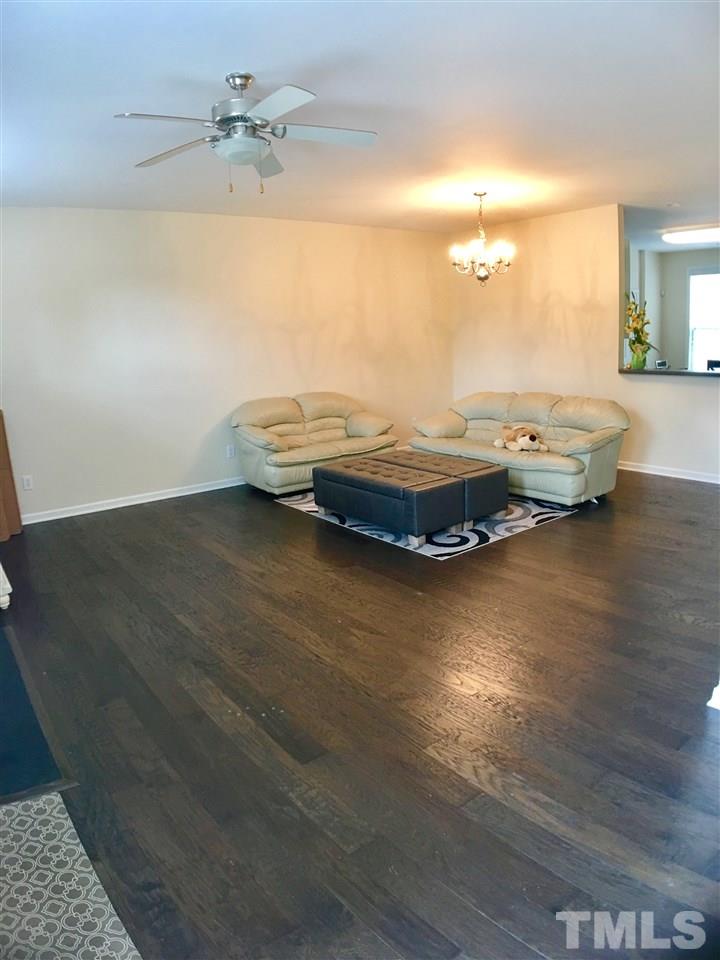 4433 Moss Garden Path Raleigh, NC 27616 - Photo 11 of 20 a view of a room with wooden floor