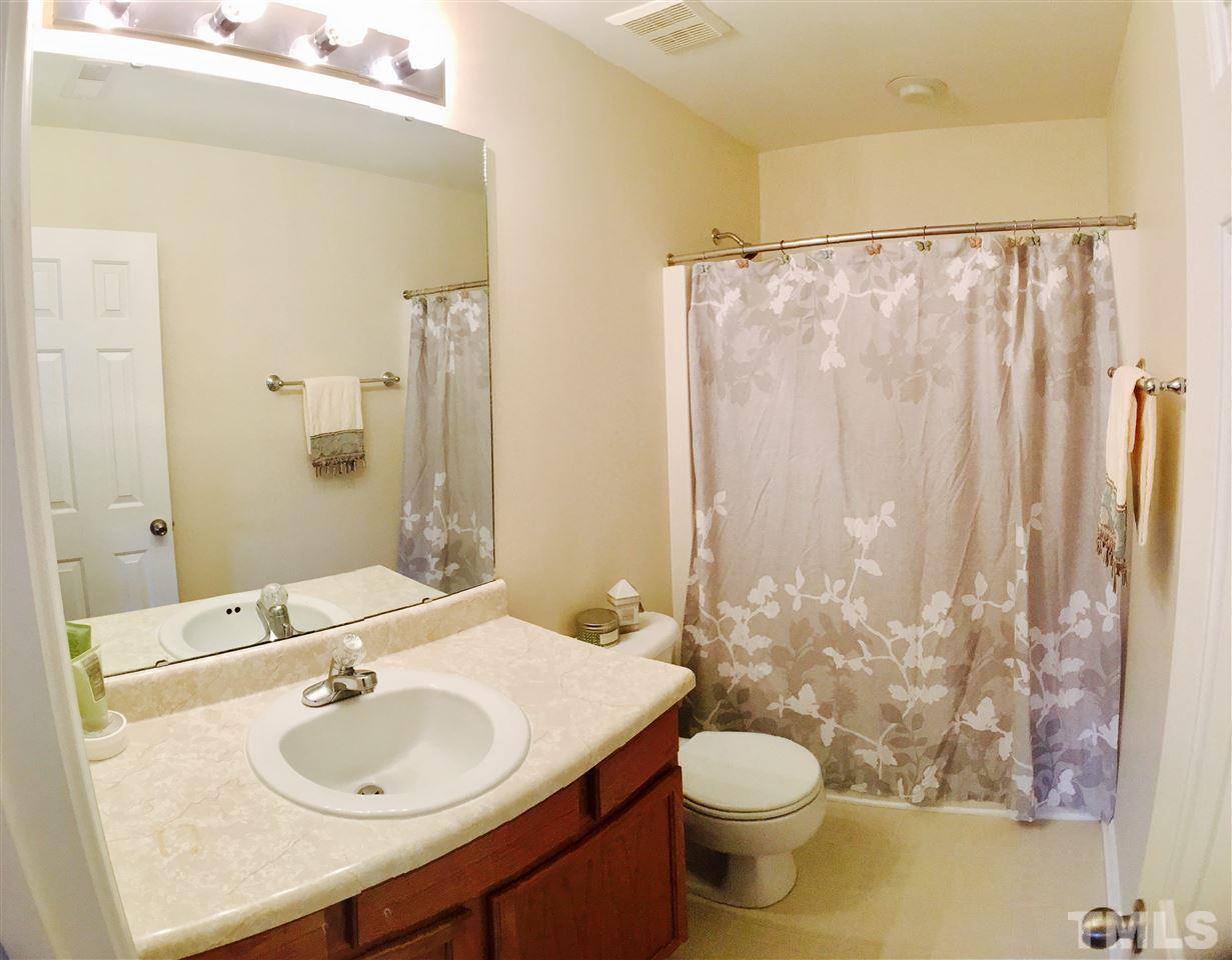 4433 Moss Garden Path Raleigh, NC 27616 - Photo 13 of 20 a bathroom with a sink toilet and shower