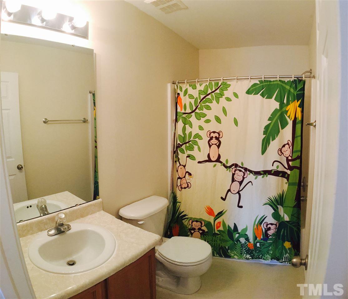 4433 Moss Garden Path Raleigh, NC 27616 - Photo 16 of 20 a bathroom with a toilet and a sink