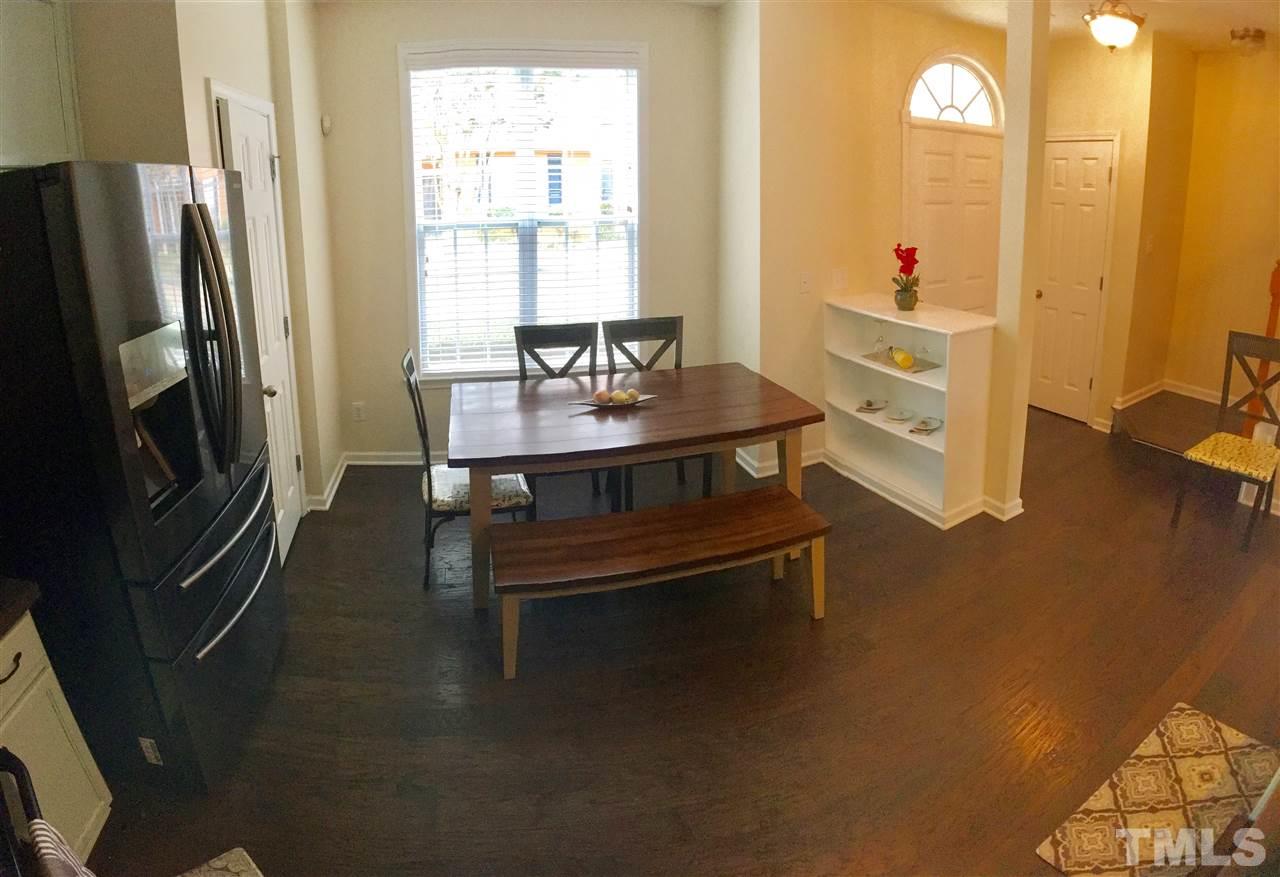 4433 Moss Garden Path Raleigh, NC 27616 - Photo 7 of 20 a dining room with furniture and a window