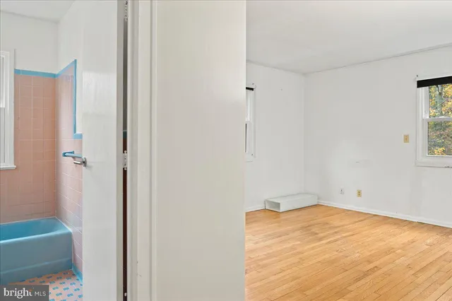 a room with a bed and a window