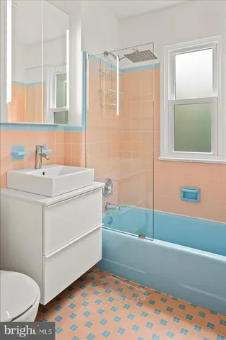 a bathroom with a sink a bathtub and a shower