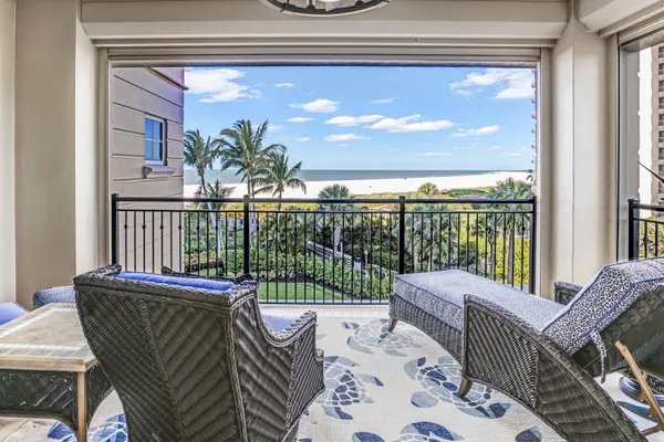 a view of a balcony with furniture