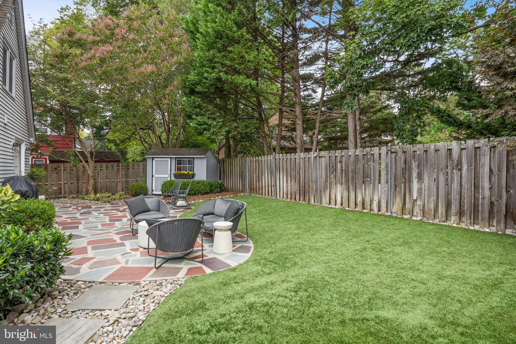 219 West Summit Avenue Haddonfield, NJ 08033 - Photo 27 of 29 a view of backyard with table and chairs and wooden fence