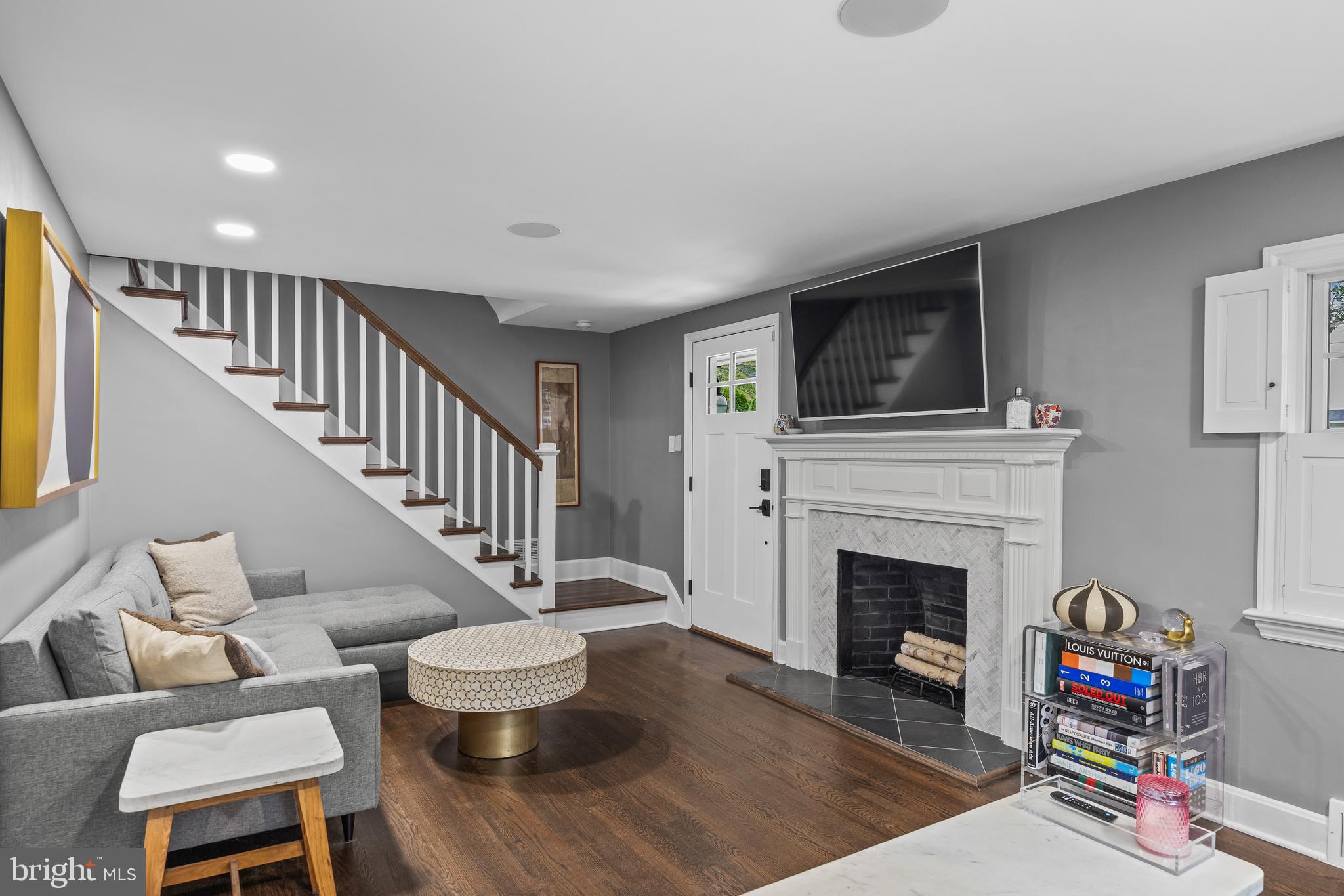 219 West Summit Avenue Haddonfield, NJ 08033 - Photo 4 of 29 a living room with furniture a flat screen tv and a fireplace