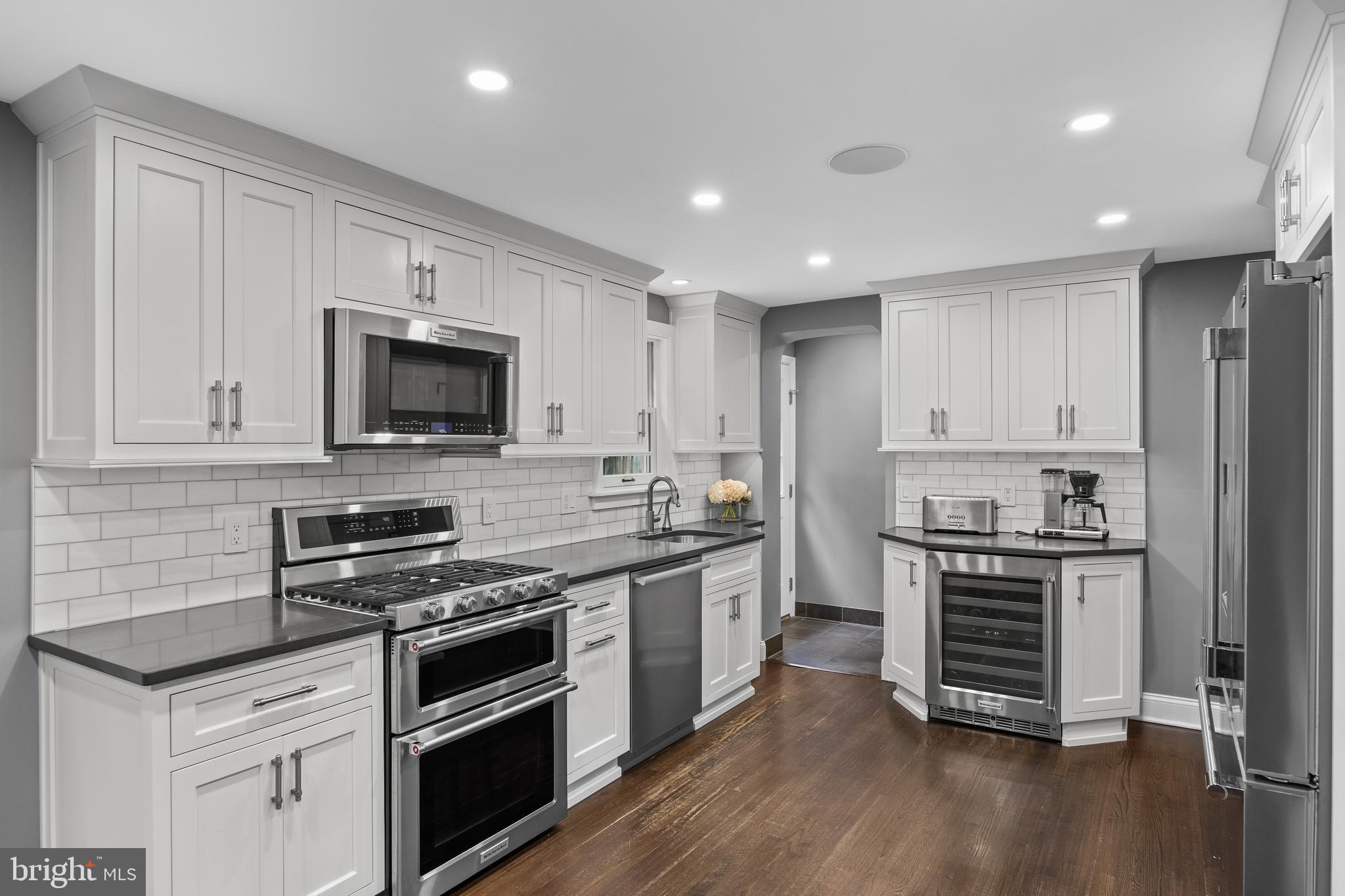 219 West Summit Avenue Haddonfield, NJ 08033 - Photo 5 of 29 a kitchen with stainless steel appliances a stove sink and cabinets